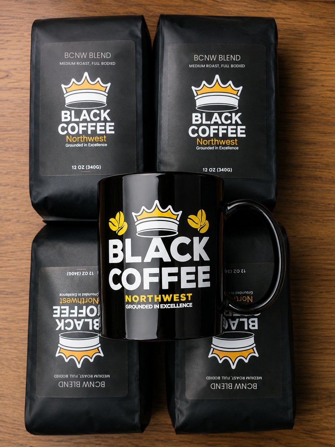 Bags of Black Coffee Northwest BCNW Blend with a Black Coffee Northwest mug